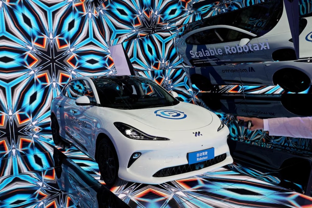 A Momenta Robotaxi is displayed at the booth of the Chinese autonomous driving startup during a media day for the Auto Shanghai show in Shanghai, China April 23, 2025. REUTERS