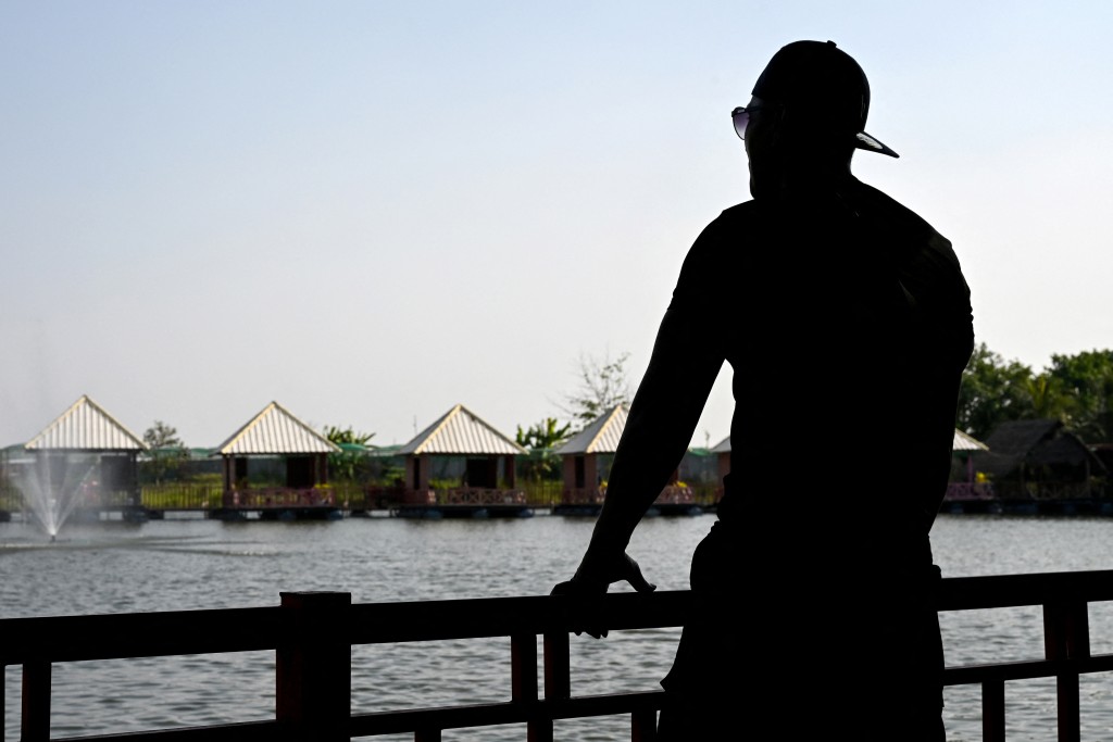 Photo by TANG CHHIN SOTHY / AFP  Cambodian Pheap Rom poses for picture at a restaurant in Phnom Penh on March 30, 2026.