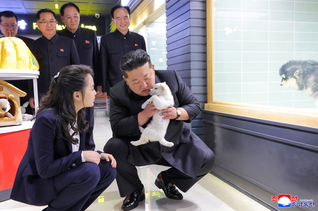 This undated picture released by North Korea's official Korean Central News Agency (KCNA) on April 3, 2026 shows North Korean leader Kim Jong Un (front R) and his daughter Kim Ju Ae (front L) inspecting a pet shop awaiting the opening of the fourth-stage district of the Hwasong Area in Pyongyang. (Photo by KCNA VIA KNS / AFP)