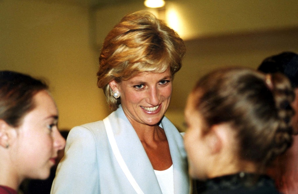 Diana, Princess of Wales, speaks with dancers at the studios of the English National Ballet August 28 on the day that her marriage to the Prince of Wales officially came to an end with the issue of a decree absolute. (Reuters) 