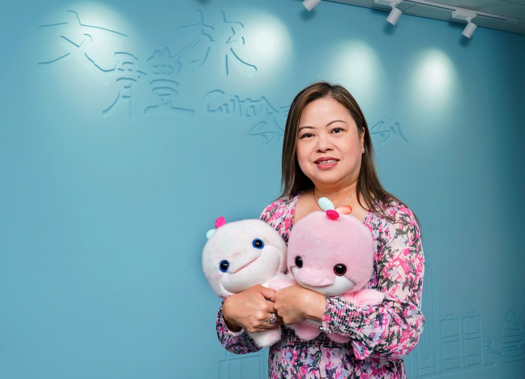 'Like a phoenix rising from the ashes, Hong Kong now shines with renewed splendor, reclaiming its former glory' Rosanna Law - holding National Games mascots