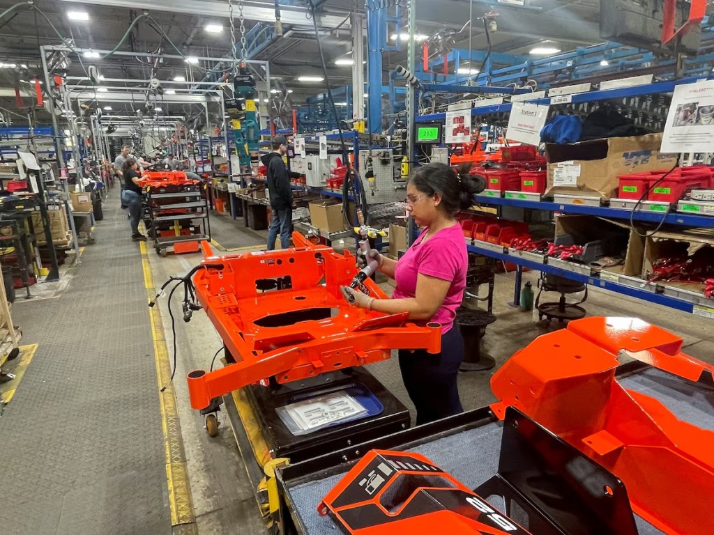 A worker installs parts at the start of an assembly line at an Ariens factory in Brillion, Wisconsin, U.S., March 5, 2025. REUTERS