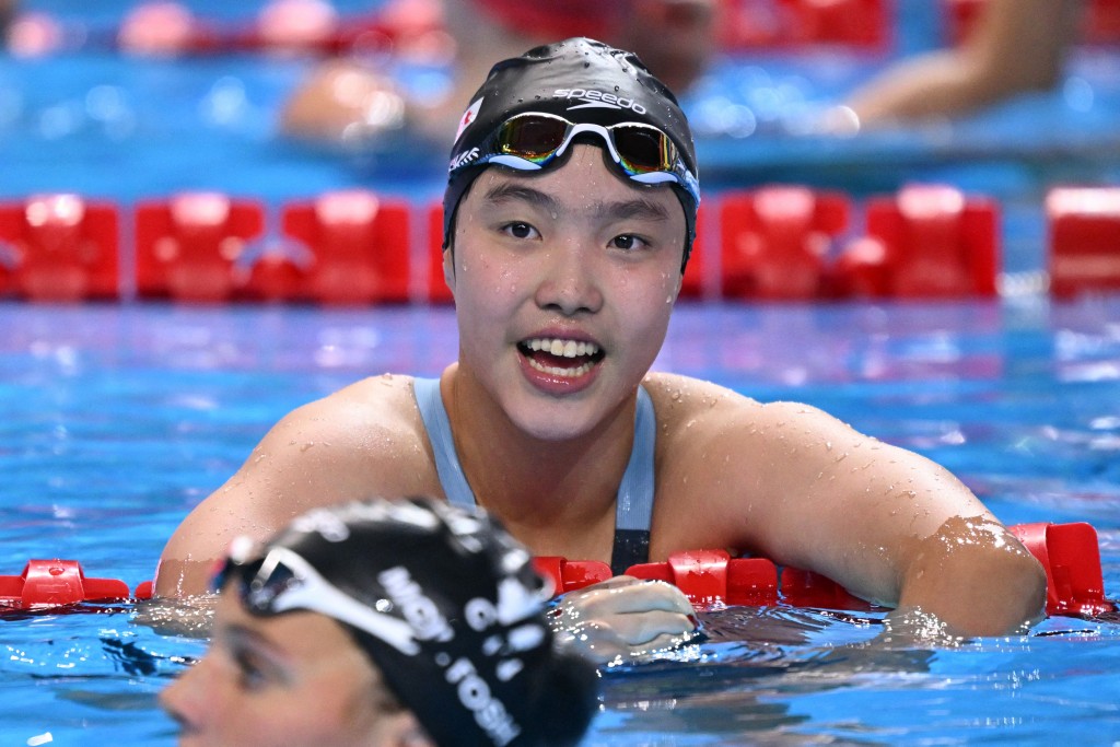China's swimmer Yu Zidi reacts after a semi-final of the women's 200m butterfly swimming event during the 2025 World Aquatics Championships in Singapore on July 30, 2025. (Photo by Oli SCARFF / AFP)