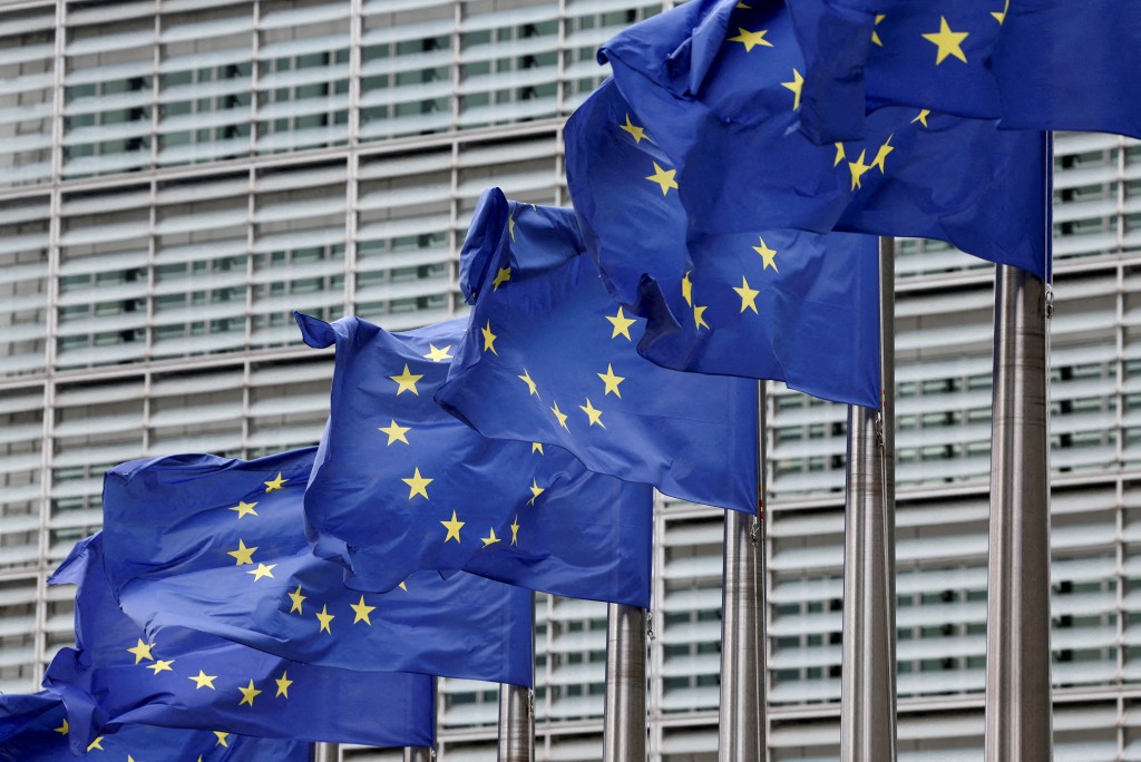 European Union flags flutter outside the EU Commission headquarters in Brussels, Belgium. (Reuters)