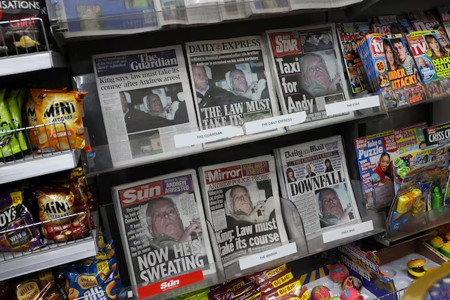 British newspapers, featuring coverage of the arrest of Andrew Mountbatten-Windsor, younger brother of Britain's King Charles, on suspicion of misconduct in public office, sit on display in a newsagent in London, Britain, February 20, 2026. REUTERS/Jack Taylor