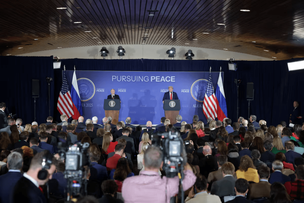 U.S. President Donald Trump and Russian President Vladimir Putin hold a press conference following their meeting to negotiate an end to the war in Ukraine, at Joint Base Elmendorf-Richardson in Anchorage, Alaska, U.S., August 15, 2025. REUTERS/Jeenah Moon 