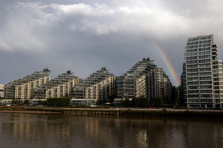 A rainbow is seen over apartments in Wandsworth on the River Thames in London, in August 2023. Photo by REUTERS