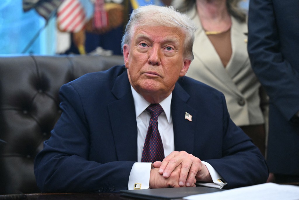 US President Donald Trump speaks looks on after signing an order sending National Guard troops to Memphis, in the Oval Office of the White House in Washington, DC, on September 15, 2025.  (Photo by SAUL LOEB / AFP)