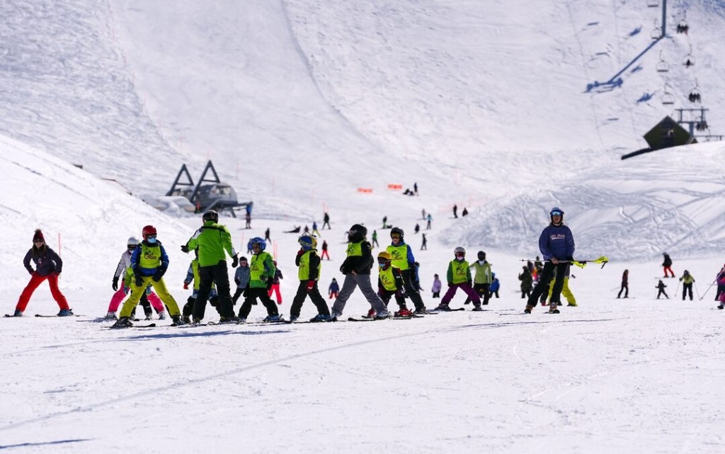 People ski at a ski resort in Kfardebian, Lebanon, February 13, 2022. REUTERS/Issam Abdallah