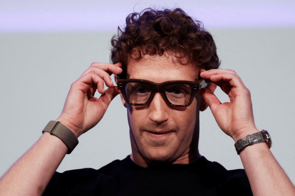 Meta CEO Mark Zuckerberg wears the Meta Ray-Ban Display glasses, as he delivers a speech presenting the new line of smart glasses, during the Meta Connect event at the company's headquarters in Menlo Park, California, U.S., September 17, 2025. REUTERS/Carlos Barria/File Photo