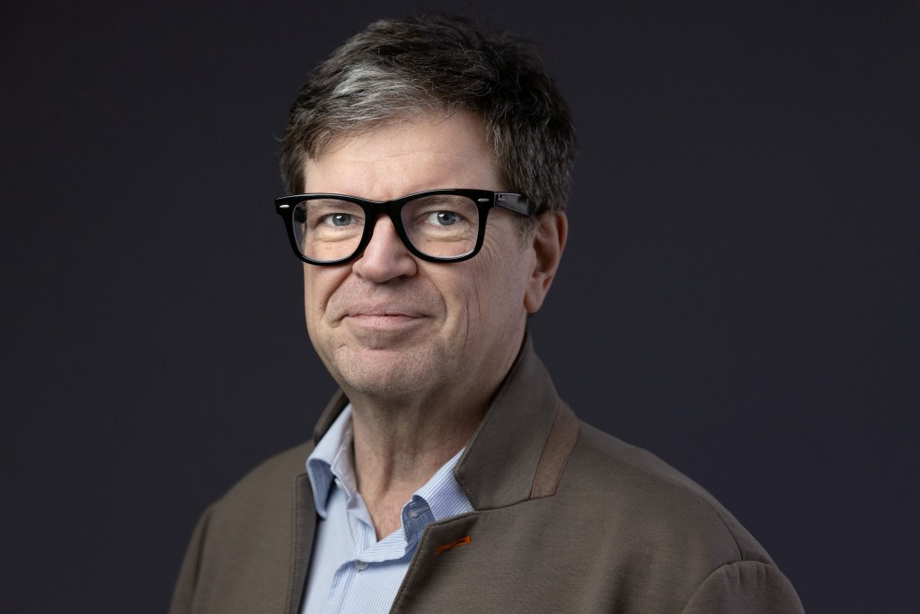 Photo by JOEL SAGET / AFP  AI chief for Facebook owner Meta Yann LeCun poses during the AI Action Summit in Saclay on February 6, 2025.