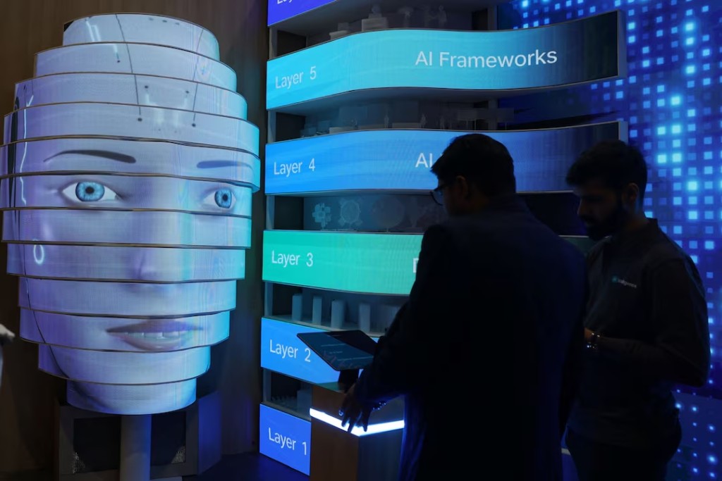  Visitors check a Jio intelligence bot on display at Bharat Mandapam, one of the venues for AI Impact Summit, in New Delhi, India, February 17, 2026. REUTERS/Bhawika Chhabra