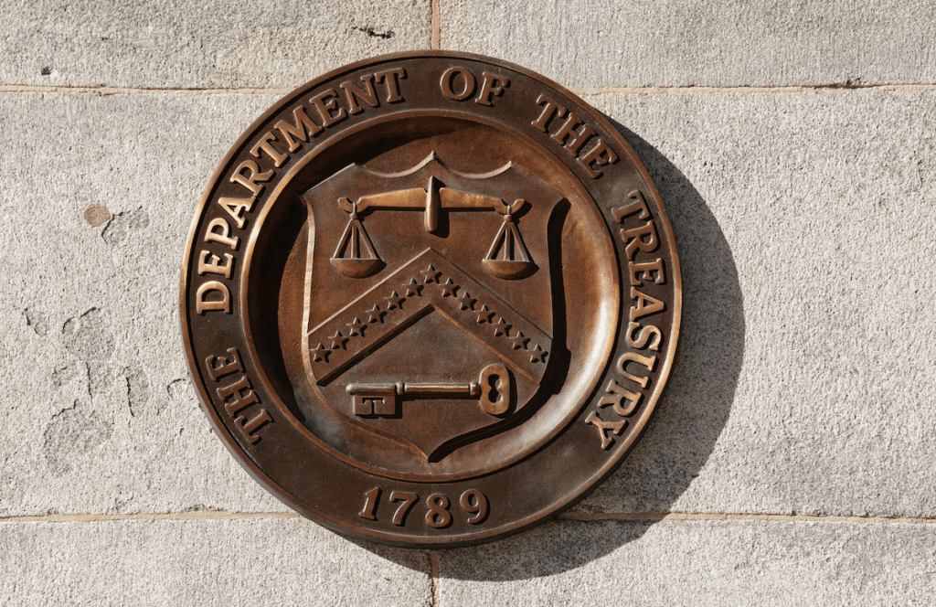 A bronze seal for the Department of the Treasury is shown at the U.S. Treasury building in Washington, U.S., January 20, 2023.  REUTERS/Kevin Lamarque/ File Photo