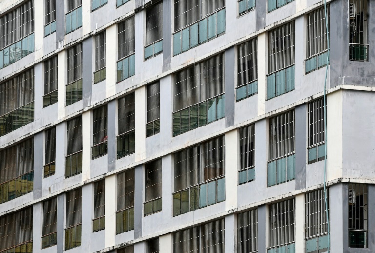 Steel bars cover the windows of empty buildings inside the Chinatown district in Sihanoukville in Preah Sihanouk province. (AFP)