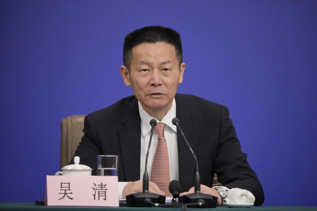 Wu Qing, Chairman of the China Securities Regulatory Commission meets the press on the sideline of the National People's Congress in Beijing, China, Thursday, March 6, 2025. (AP Photo/Vincent Thian)