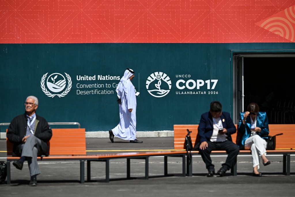 Visitors attend the 17th Session of the Conference of the Parties (COP17) of the United Nations Convention to Combat Desertification (UNCCD) at the venue in Ulaanbaatar on August 24, 2026. (Photo by Hector RETAMAL / AFP)