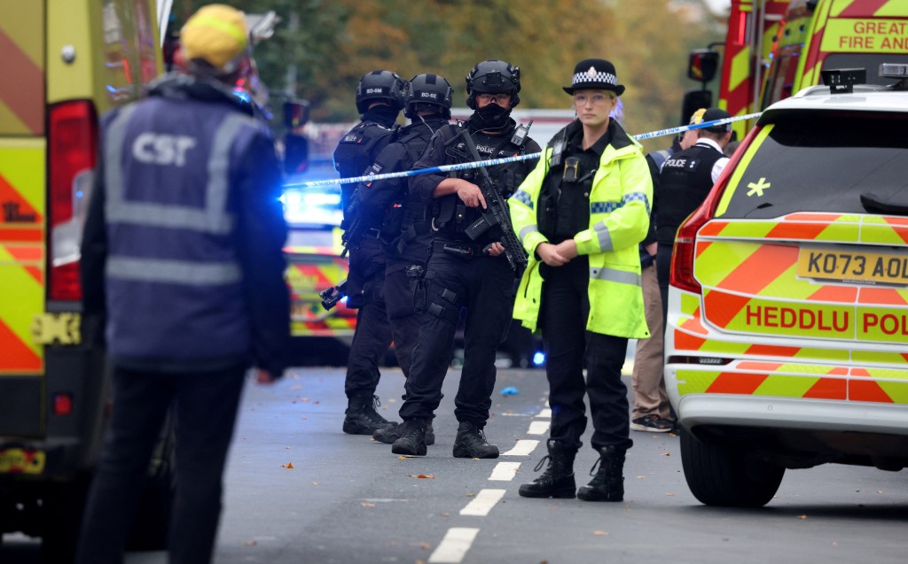Emergency personnel work at the scene, after an attack in which a car was driven at pedestrians and stabbings were reported near a synagogue in north Manchester, Britain, October 2, 2025. (Reuters)
