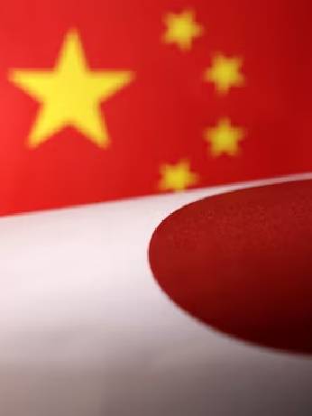 Printed Chinese and Japanese flags are seen in this illustration, July 21, 2022. REUTERS/Dado Ruvic/Illustration