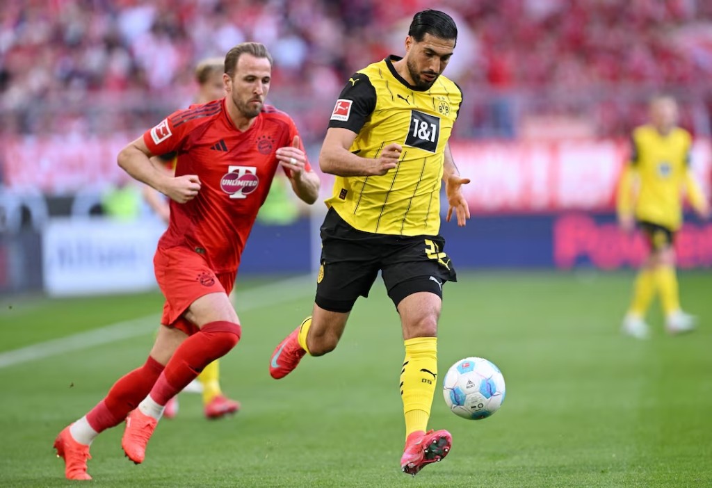Bayern Munich's Harry Kane in action with Borussia Dortmund's Emre Can