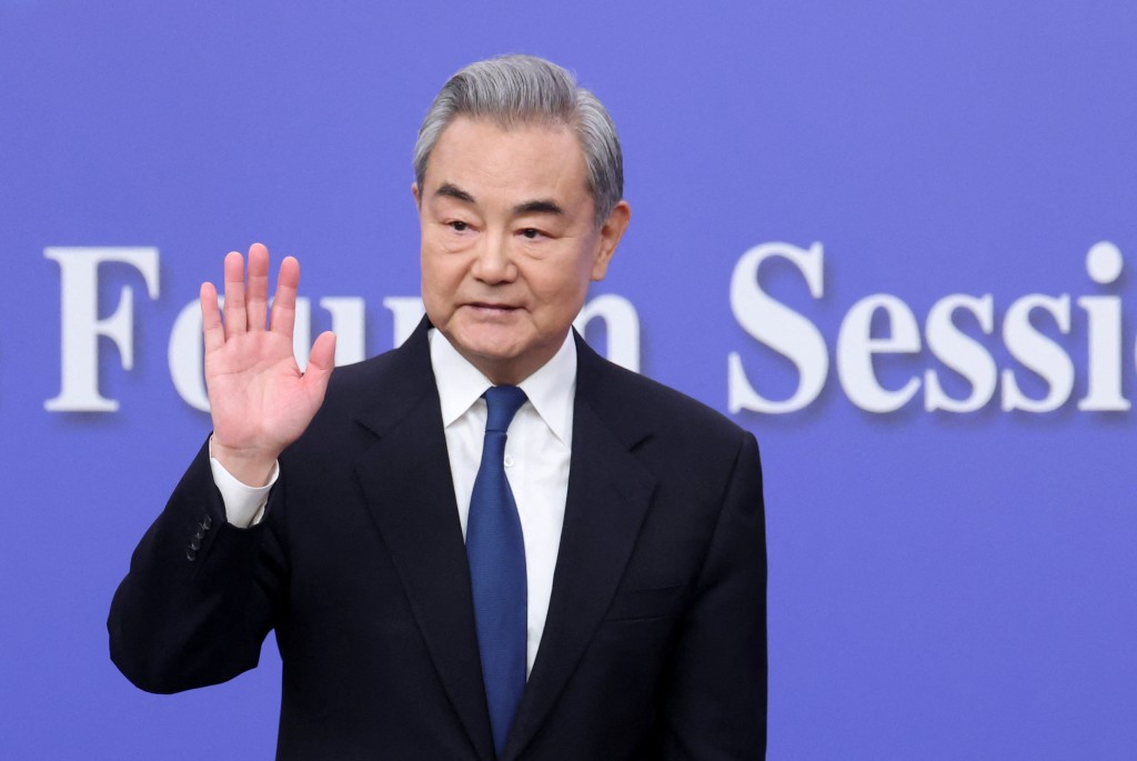 Chinese Foreign Minister Wang Yi waves after a press conference on the sidelines of the National People's Congress (NPC), in Beijing, China, March 8, 2026. (Reuters)