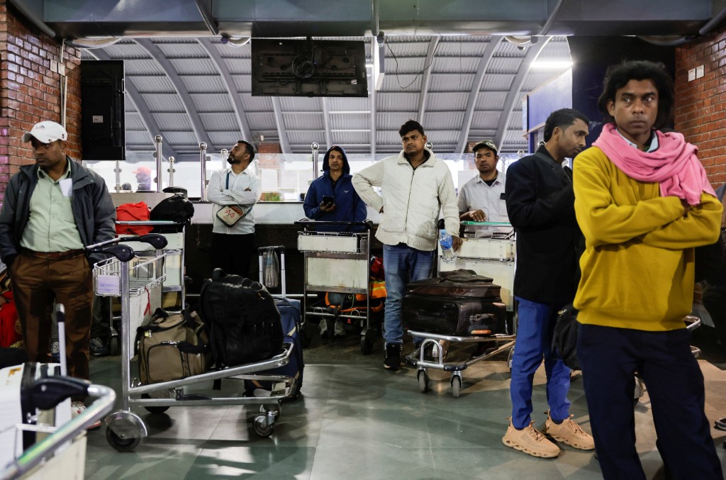 Stranded passengers wait at Tribhuvan International Airport after all evening flights to Sharjah, Doha, Dubai, Kuwait City, Abu Dhabi, and Dammam were cancelled, following strikes on Iran launched by the United States and Israel, in Kathmandu, Nepal, February 28, 2026. (Reuters)