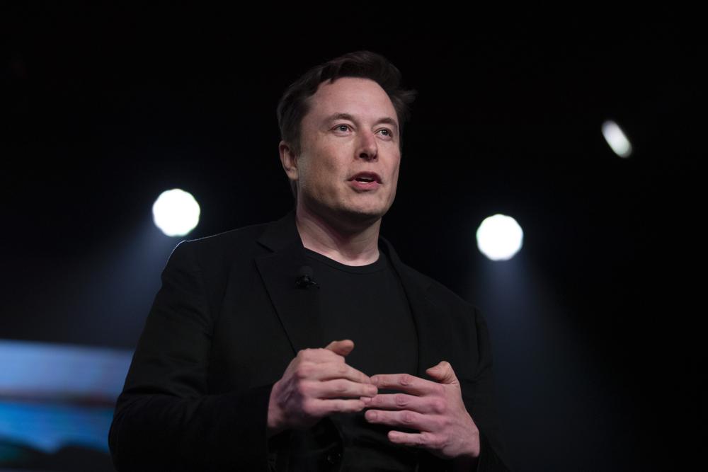 In this March 14, 2019, file photo, Tesla CEO Elon Musk speaks before unveiling the Model Y at the company's design studio in Hawthorne, California. In this March 14, 2019, file photo, Tesla CEO Elon Musk speaks before unveiling the Model Y at the company's design studio in Hawthorne, California.