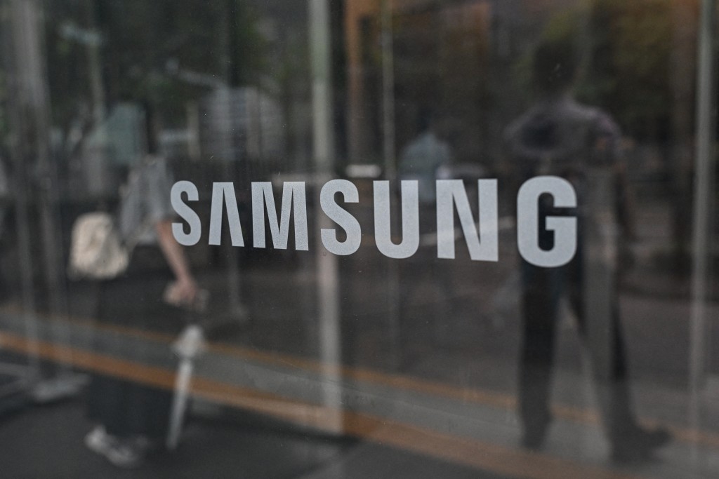 Photo by JADE GAO / AFP  The logo of Samsung is seen at the Samsung Electronics Seocho building in Seoul on July 7, 2026.