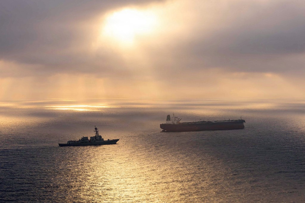 This US Navy handout photo released on May 8, 2026 by US Central Command Public Affairs, shows the Arleigh Burke-class guided-missile destroyer USS Rafael Peralta (DDG 115) implementing a maritime blockade against the Iran-flagged crude oil tanker vessel Herby while the latter was attempting to sail toward an Iranian port, on April 24, 2026. (AFP)