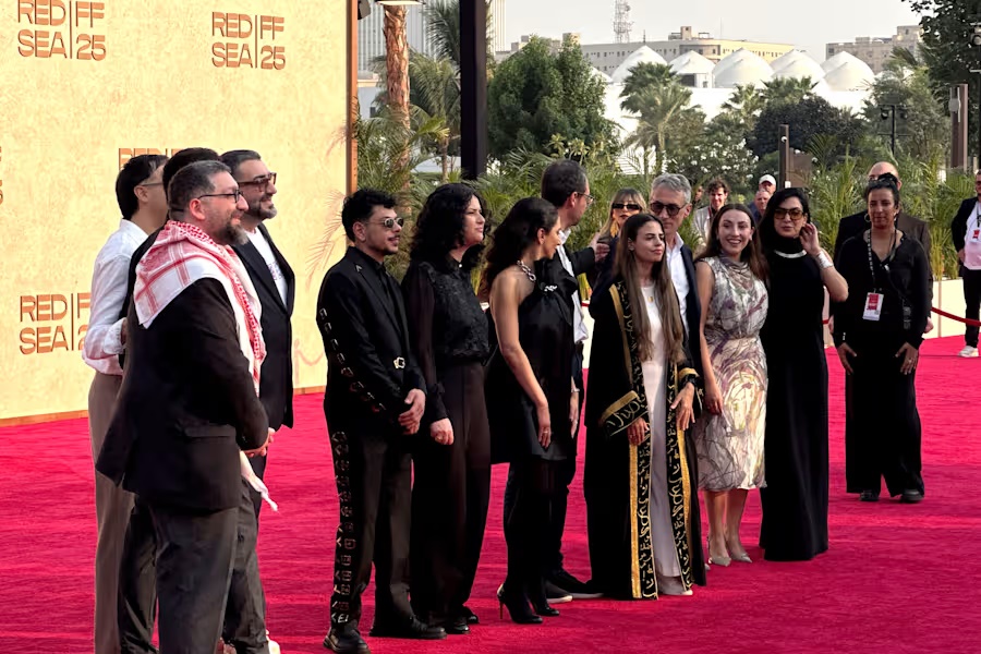 From left, Abdallah Sada, Alaa Alasad, Mohammad Siam, Israel Banuelos, Bassam Alasad, Mohammad Nizar, director Zain Duraie, Clara Khoury, George Christopoulos, Glenn Gainor, Ghalia Hatamleh and Lara Ab attend the screening of the film "Sink" during the Red Sea International Film Festival in Jeddah, Saudi Arabia, Monday, Dec. 8, 2025. (AP Photo/Baraa Anwer)