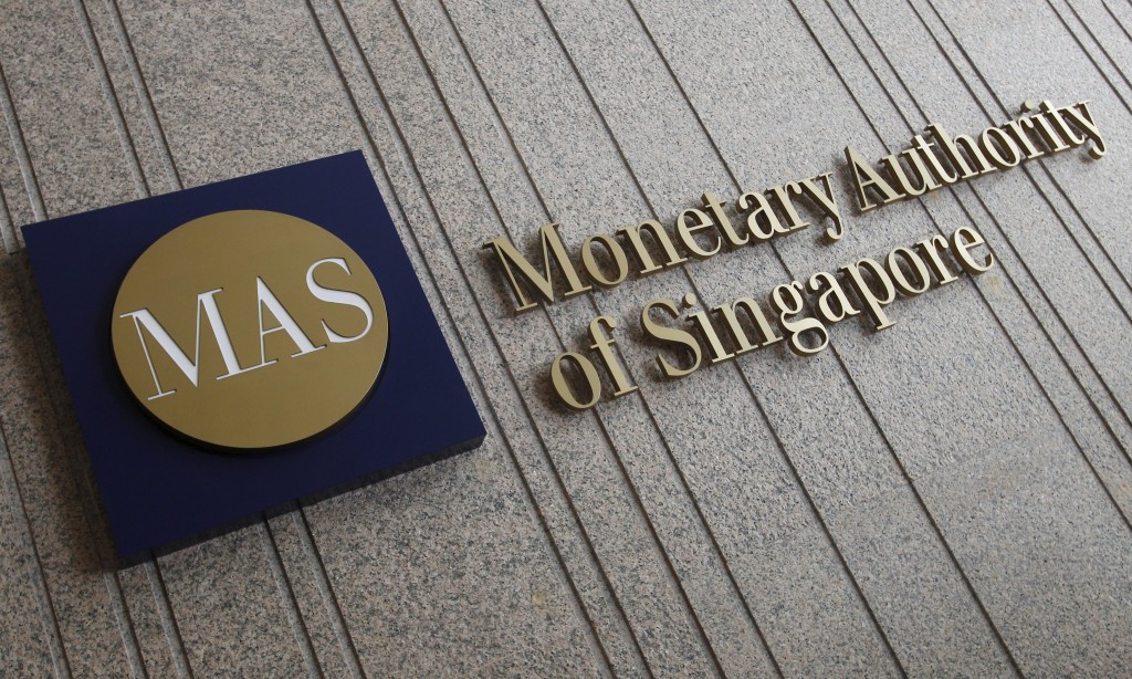 The logo of the Monetary Authority of Singapore (MAS) is pictured at its building in Singapore in this February 21, 2013 file photo. Reuters