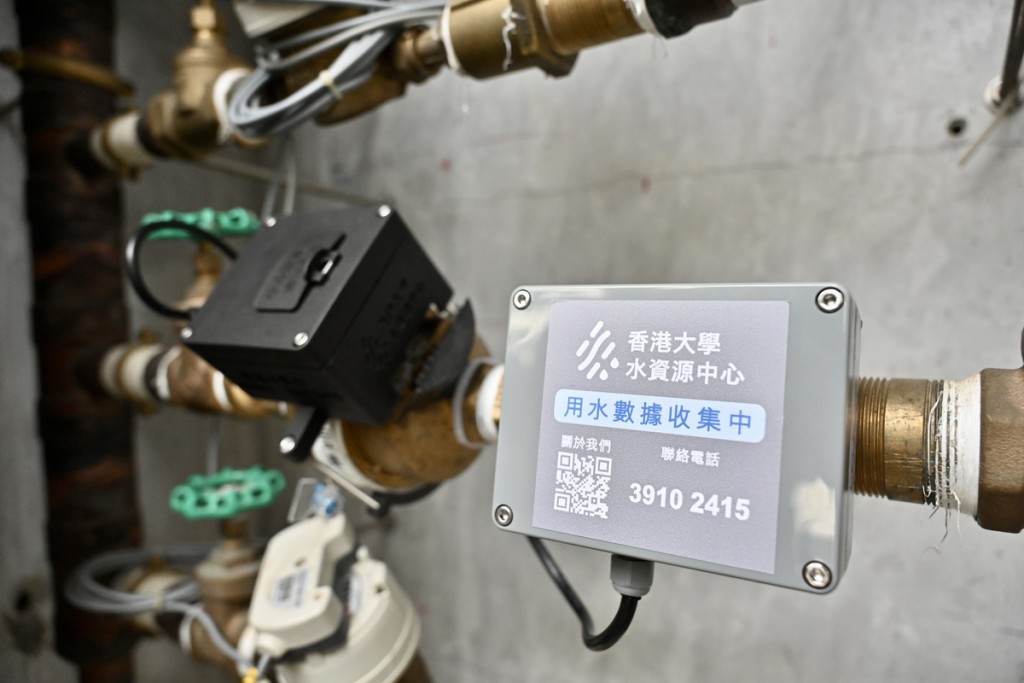 Smart water meter readers are installed on existing meters, transmitting data for AI-driven analysis. (Reuters)