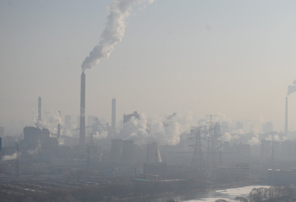 Smog billows from chimneys and cooling towers of a steel plant during hazy    weather in Taiyuan, Shanxi province, China, December 28, 2016. REUTERS/Stringer