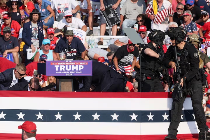 Secret Service agents fatally shot the shooter after he opened fire from the roof of a building about 150 yards (140 m) from the stage where Trump was speaking.T he shots appeared to come from outside the area secured by the Secret Service, the agency said. REUTERS/Brendan McDermid Secret Service agents fatally shot the shooter after he opened fire from the roof of a building about 150 yards (140 m) from the stage where Trump was speaking.T he shots appeared to come from outside the area secured by the Secret Service, the agency said. REUTERS/Brendan McDermid