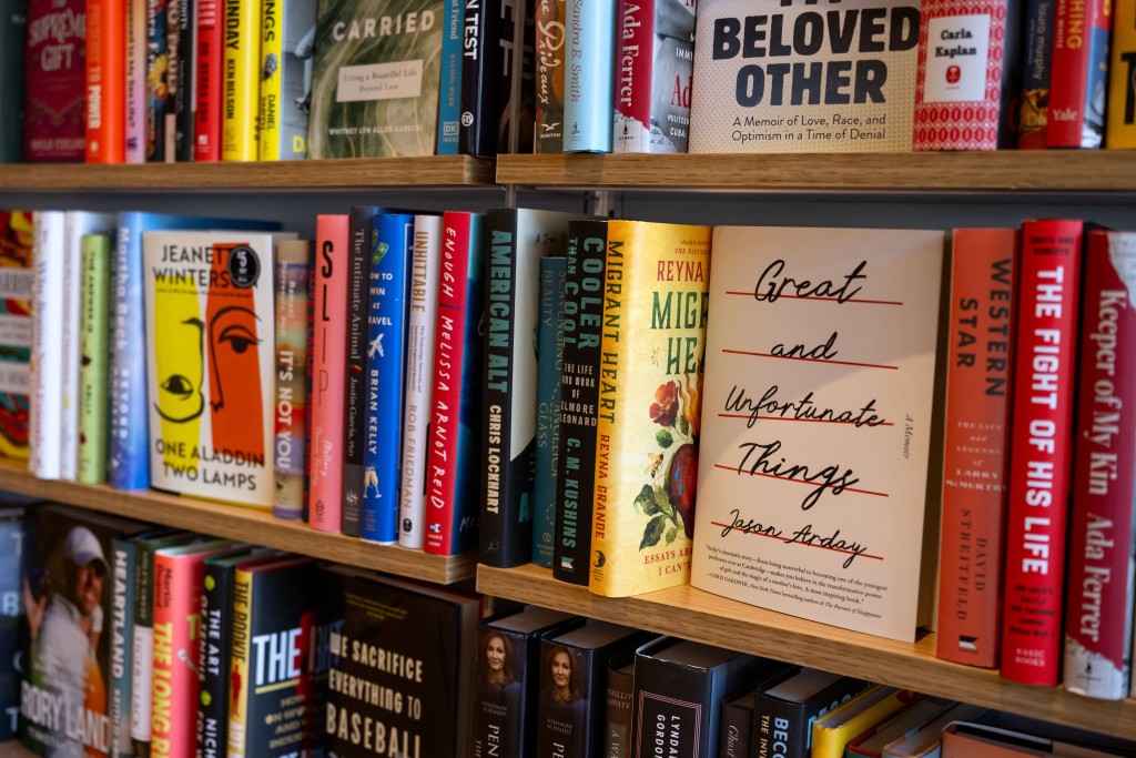 Photo by KENT NISHIMURA / AFP  A copy of "Great and Unfortunate Things" by late British academic Jason Arday is displayed on a shelf at a bookstore in Washington, DC, on August 17, 2026.