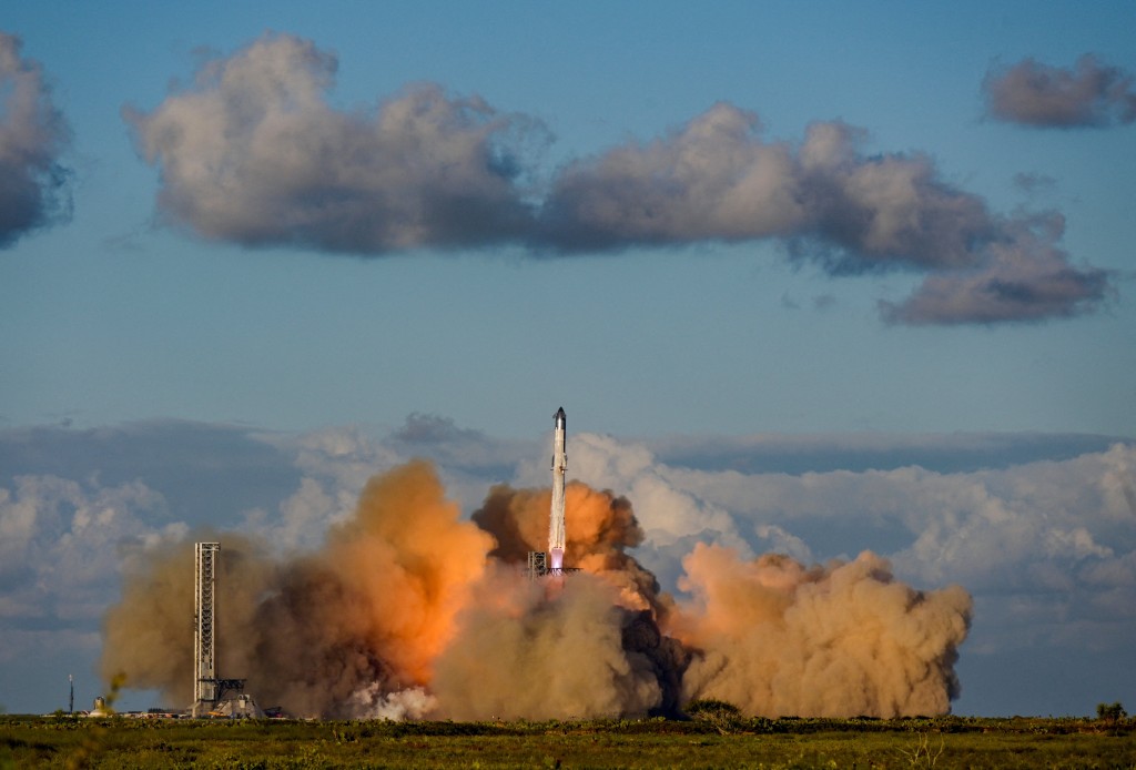 A SpaceX Super Heavy booster carrying the Starship spacecraft lifts off on its 11th test flight at the company's launch pad in Starbase, Texas, U.S., October 13, 2025. REUTERS/Steve Nesius/File Photo