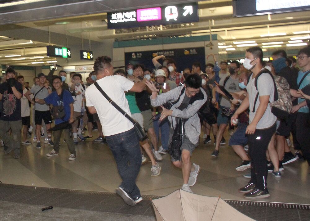 Around 100 white-clad men armed with sticks and baton raided the Yuen Long MTR station on July 21 last year, attacking anti-extradition protesters and commuters. Photo: Online. Around 100 white-clad men armed with sticks and baton raided the Yuen Long MTR station on July 21 last year, attacking anti-extradition protesters and commuters. Photo: Online.