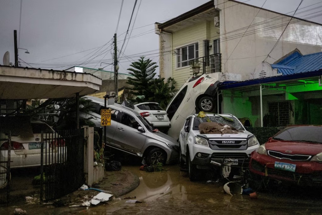 Damaged cars are toppled in a subdivision after heavy flooding brought by Typhoon Kalmaegi in Bacayan, Cebu City, Philippines, November 4, 2025. REUTERS/Eloisa Lopez