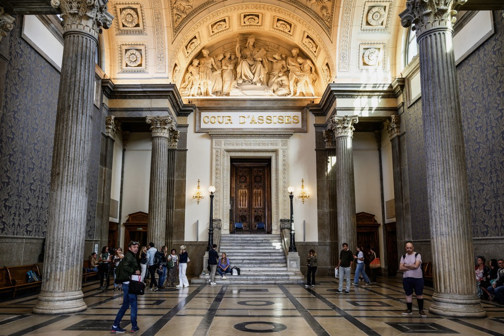Photo by JEFF PACHOUD / AFP. This photograph shows courtroom's entrance before the opening of the trial of a man accused of drugging his wife and raping her while she was unconscious, at the court in Lyon on June 11, 2026.