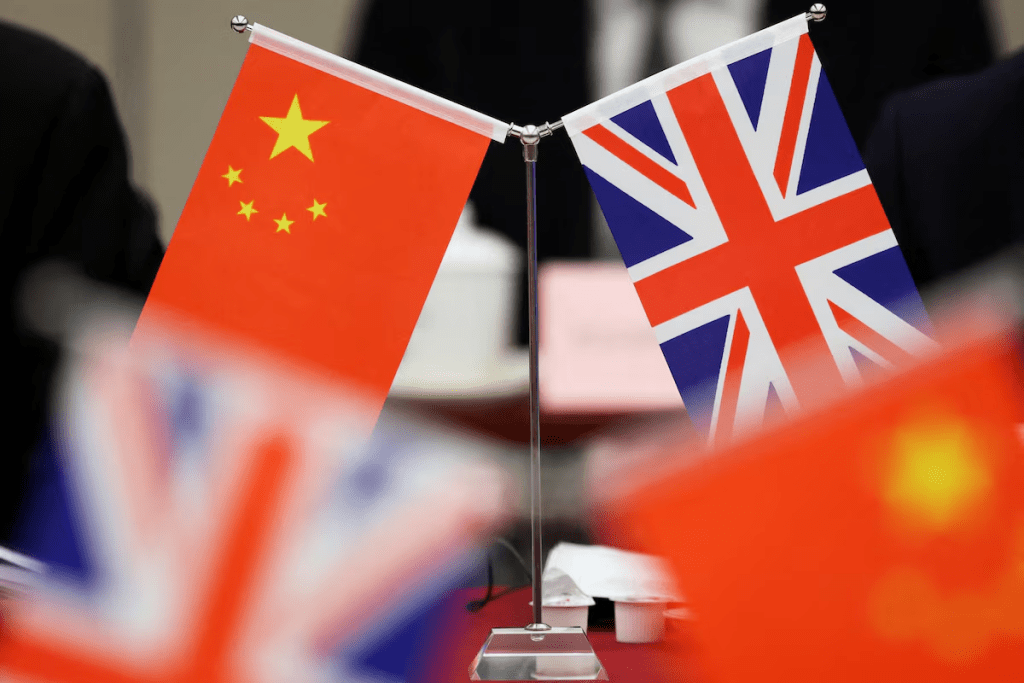 Flags of China and the Union Jack stand during the China-UK Energy Dialogue in Beijing, China March 17, 2025. REUTERS/Florence Lo/Pool