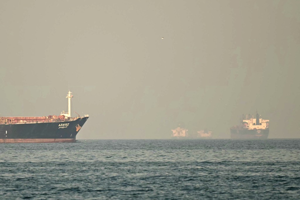 Cargo ships and tankers are seen off coast city of Fujairah, in the Strait of Hormuz in the northern Emirate on February 25, 2026. (AFP)