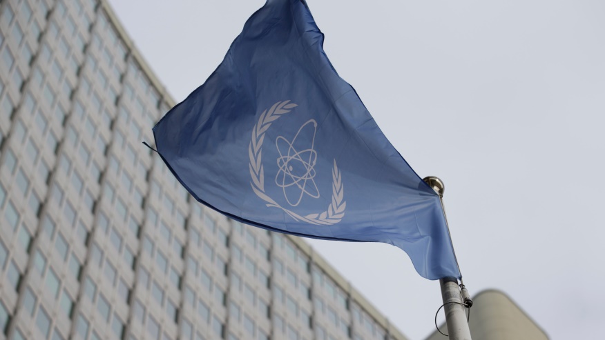 FILE – The flag of the International Atomic Energy Agency flys in front of its headquarters during an IAEA Board of Governors meeting in Vienna, Austria, Feb. 6, 2023. (AP Photo/Heinz-Peter Bader, File)