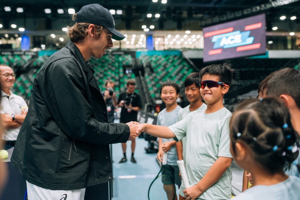 World No. 7 Alex de Minaur shook hands with children at the venue on Sunday.