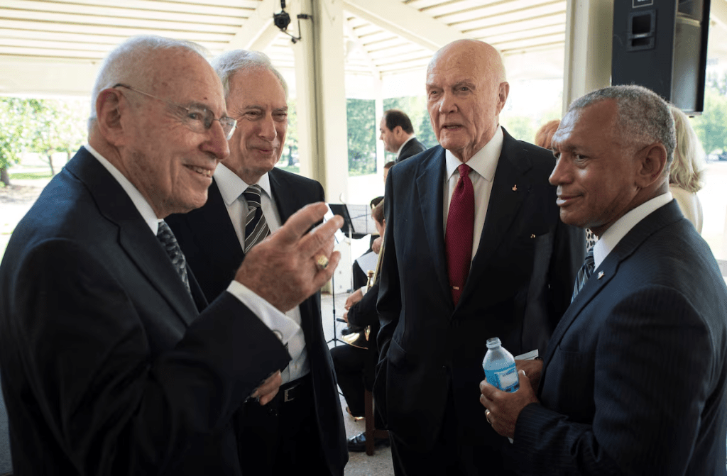 Apollo 13 astronaut Jim Lovell (L to R), former NASA Administrator Dan Goldin, Sen. John Glenn and NASA Administrator Charles Bolden talk at a private memorial service celebrating the life of Neil Armstrong at the Camargo Club in Cincinnati, Ohio in this August 31, 2012 NASA handout photo/File Photo