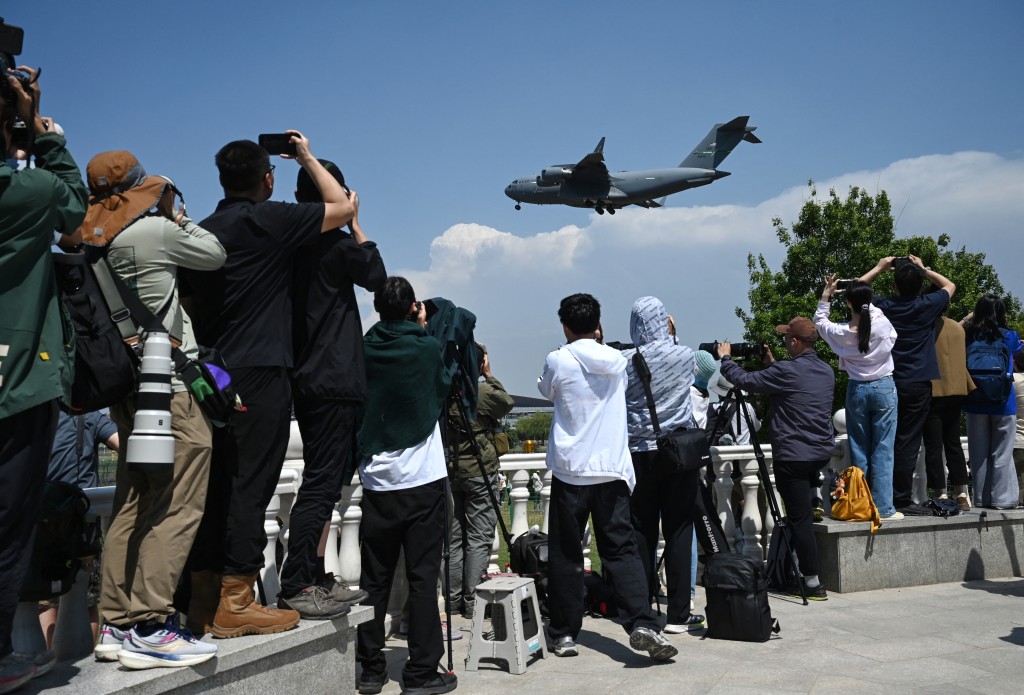 Photo by GREG BAKER / AFP  A US Air Force C-17 lands at Beijing Capital Airport in Beijing on May 11, 2026, ahead of a visit by U.S. President Donald Trump.
