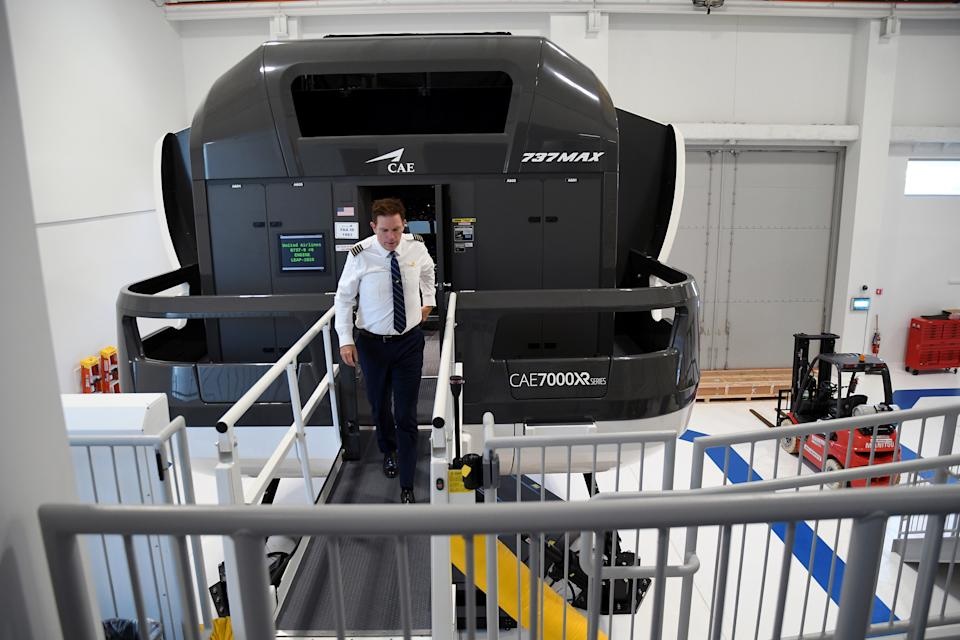 Capt. Miles Morgan, managing director of flight training for United Airlines, exits a simulator at the company's training campus in Denver, Friday, May 16, 2025. (AP Photo/Thomas Peipert)