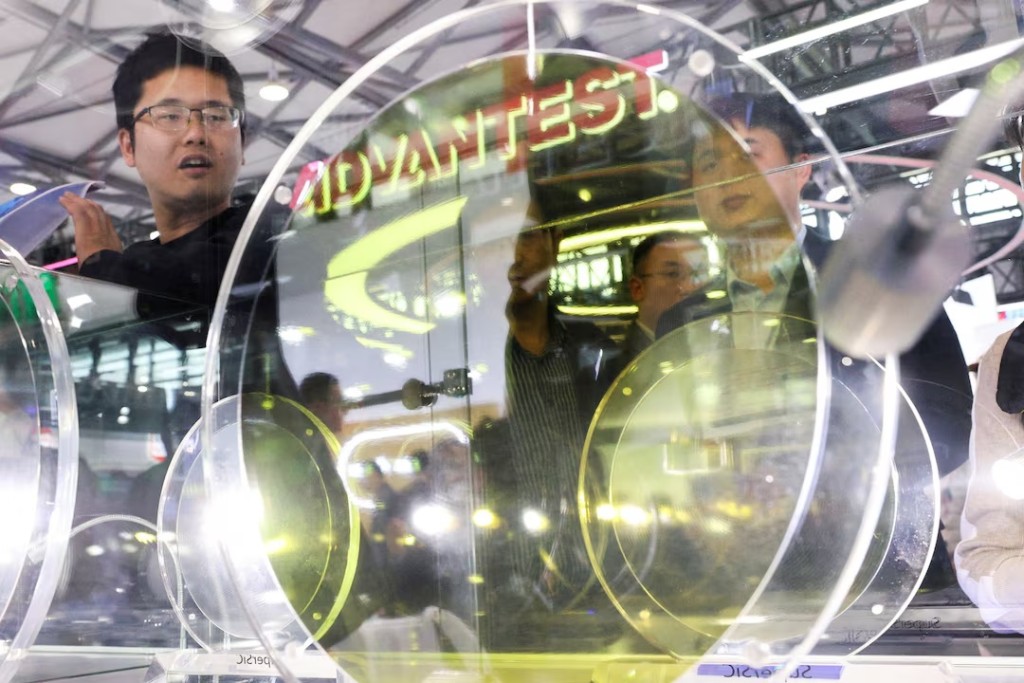Visitors look at a display of semiconductor devices at the SuperSiC booth during SEMICON China, a trade fair for semiconductor technology, in Shanghai, China, March 25, 2026. REUTERS/Go Nakamura/File Photo
