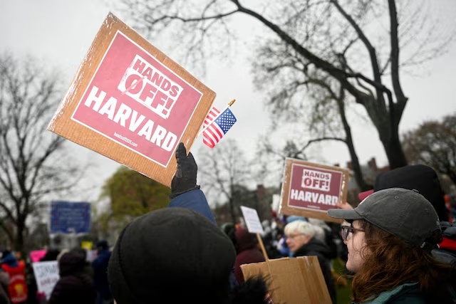 Demonstrators rally on Cambridge Common in a protest organized by the City of Cambridge calling on Harvard leadership to resist federal government interference at the university in Cambridge, Massachusetts, U.S. April 12, 2025. REUTERS/Nicholas Pfosi/File Photo