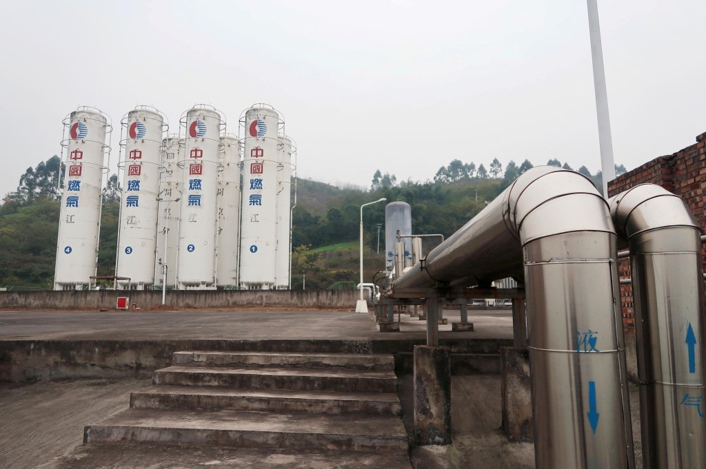 Gas storage facilities owned by China Gas Holdings are seen at a refueling station for ships in Chongqing, China December 12, 2017. Picture taken December 12, 2017. REUTERS