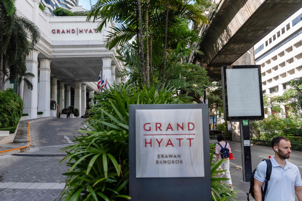 People walk past the main entrance of the Grand Hyatt Erawan hotel in Bangkok on July 17, 2024. (AFP) People walk past the main entrance of the Grand Hyatt Erawan hotel in Bangkok on July 17, 2024. (AFP)