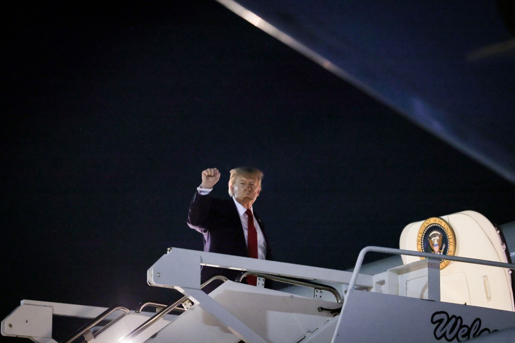 U.S. President Donald Trump boards Air Force One to travel back to Washington, DC following a rally at Sioux Gateway Airport on October 22, 2026 in Sioux City, Iowa. President Trump traveled to Iowa to rally support for local Republican candidates ahead of the upcoming midterm elections. Anna Moneymaker/Getty Images/AFP 